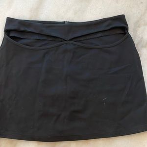 Women’s black mini skirt with cut outs in the front